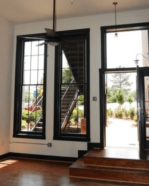 A room with a staircase and a window.