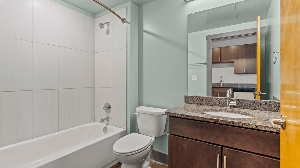 a bathroom with a sink toilet and a bath tub