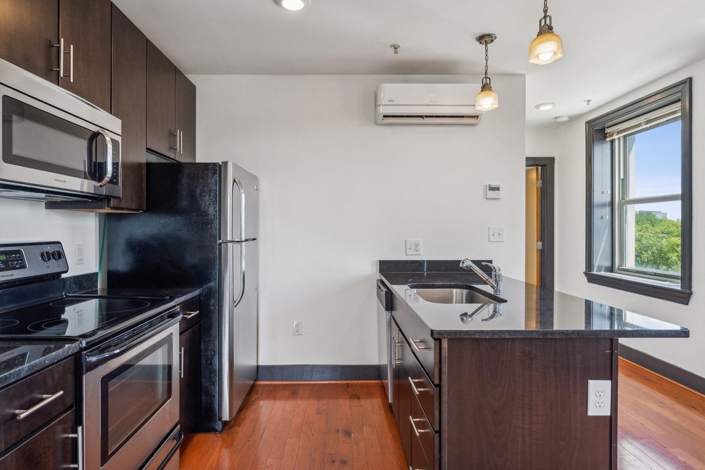 a kitchen with stainless steel appliances and a counter top