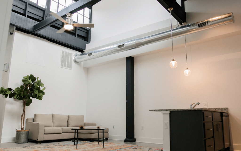 a living room with a couch and a table
