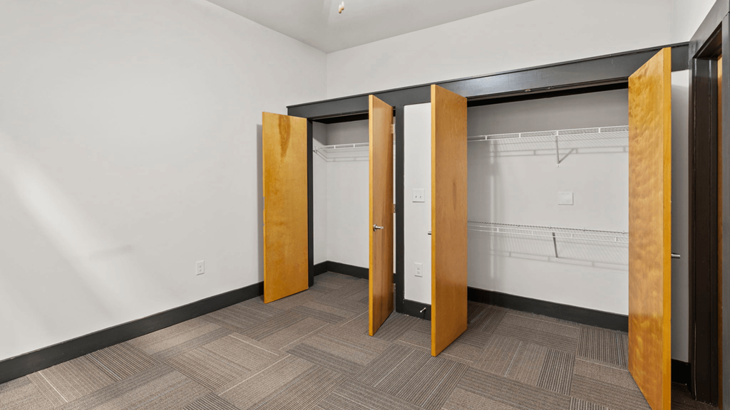 a group of stalls in a room with doors