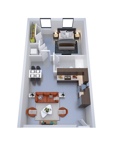 A top-down view of a small apartment with a bed, a couch, a table, and a kitchenette.