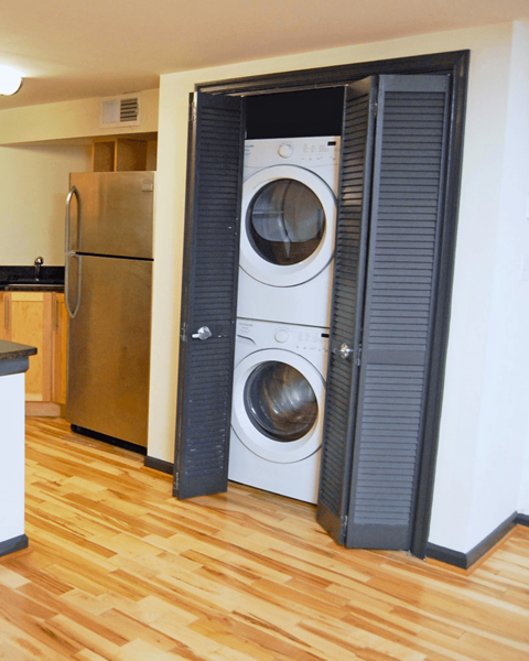 A washer and dryer are in a small laundry room.