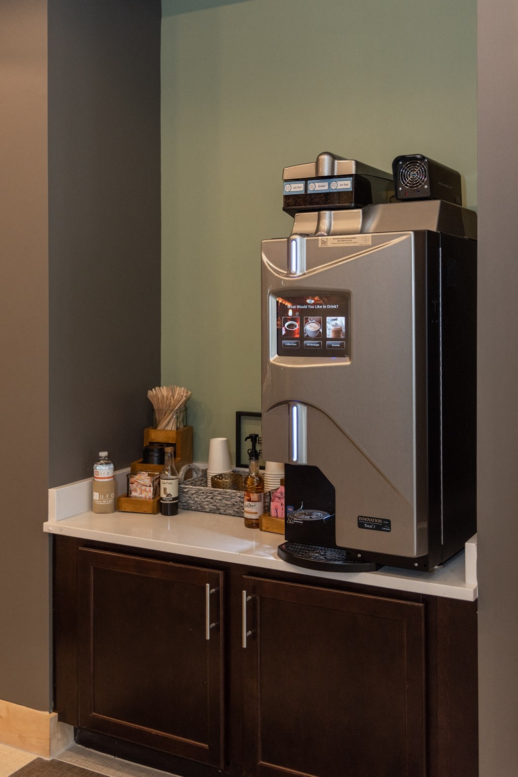 a coffee maker on a counter in a hotel room