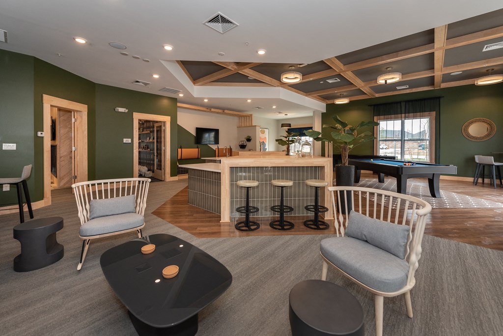 a resident clubhouse with a pool table and bar