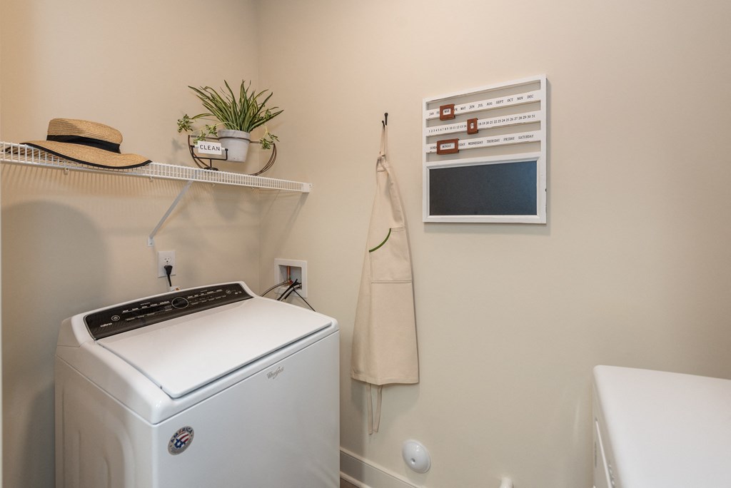 a laundry room with a washer and dryer