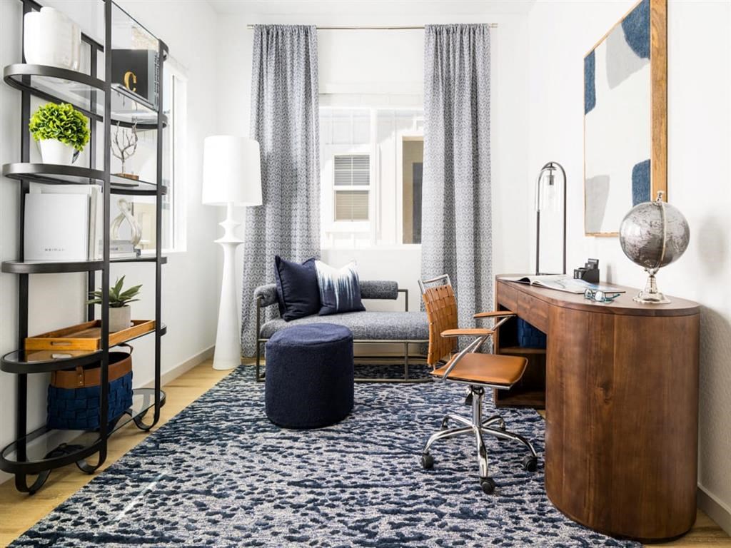 office space with blue rug
