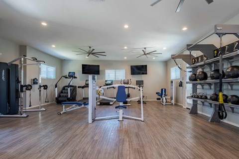 Fitness center with exercise equipment and weights at Vistoria On Mountain View Apartments, Arizona, 85374