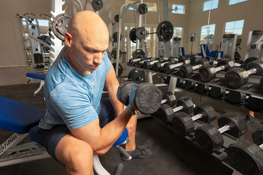 a man lifting weights in a gym