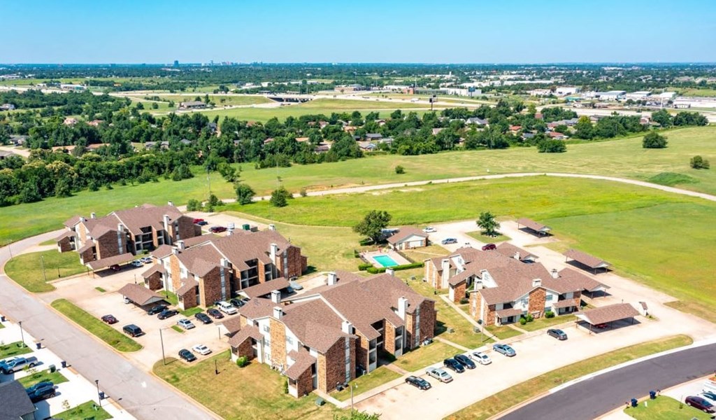 an aerial view of a large neighborhood of houses and a field