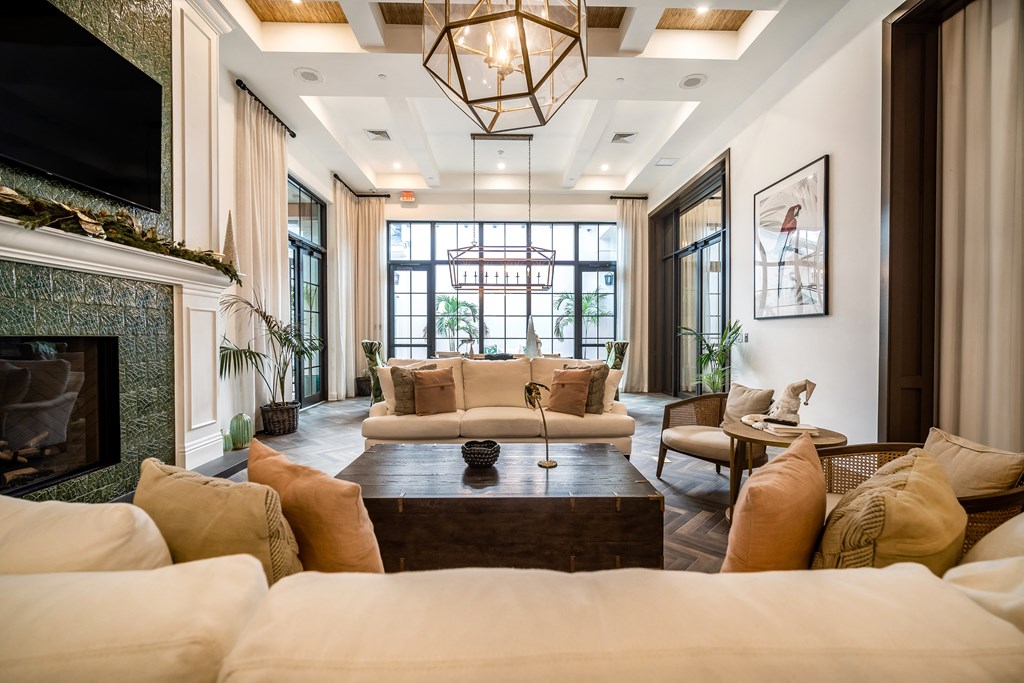 a living room filled with furniture and a fireplace at The Lotus at Village Walk, Fort Myers, 33966