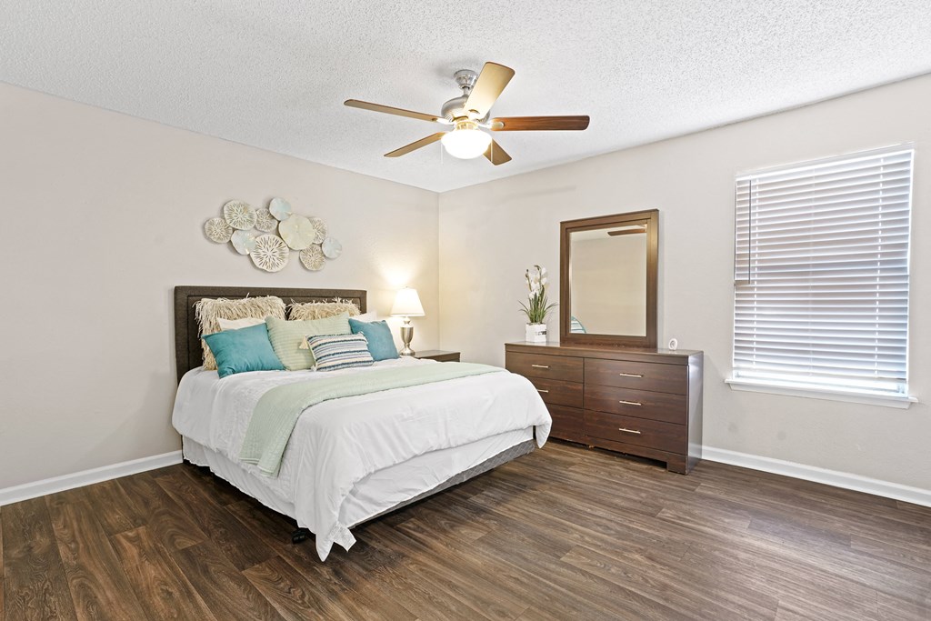 a bedroom with a bed and a ceiling fan a bedroom with a bed and a ceiling fan at Diamond Trail Apartments, Oklahoma City, Oklahoma