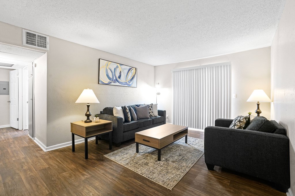 a living room with a couch and a table at Diamond  Trail Apartments, Oklahoma City