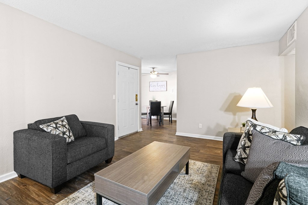 a living room with a couch and a coffee table at Diamond  Trail Apartments, Oklahoma City, OK