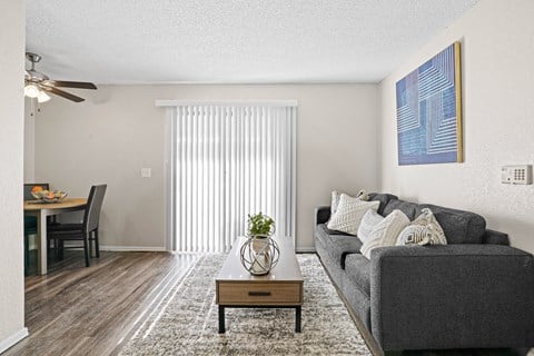 our apartments offer a living room with a couch and a table