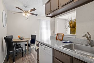 kitchen and dining area with fan