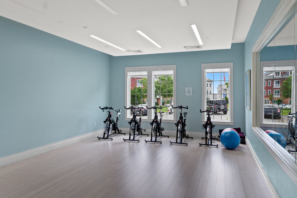an exercise room with bikes and an exercise ball at Cirrus Apartments, Massachusetts, 01721