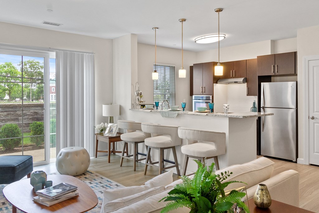 a kitchen and living room in a 555 waverly unit at Cirrus Apartments, Ashland, 01721
