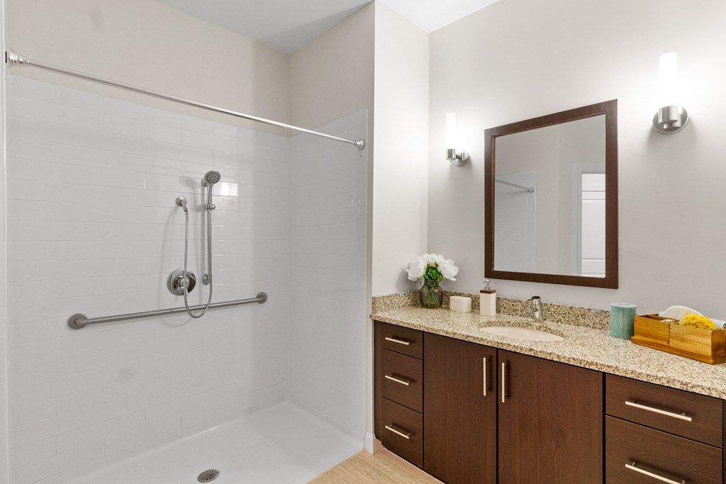 a bathroom with a shower and a sink at Cirrus Apartments, Massachusetts