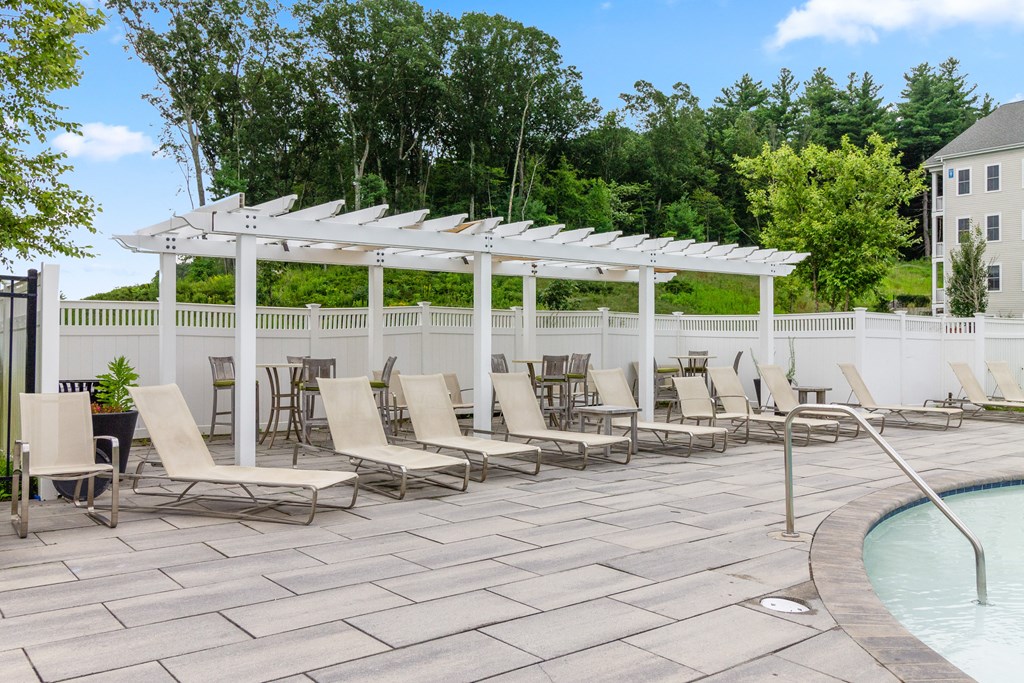 take a dip in the pool under the shade of the pergola at Cirrus Apartments, Massachusetts, 01721