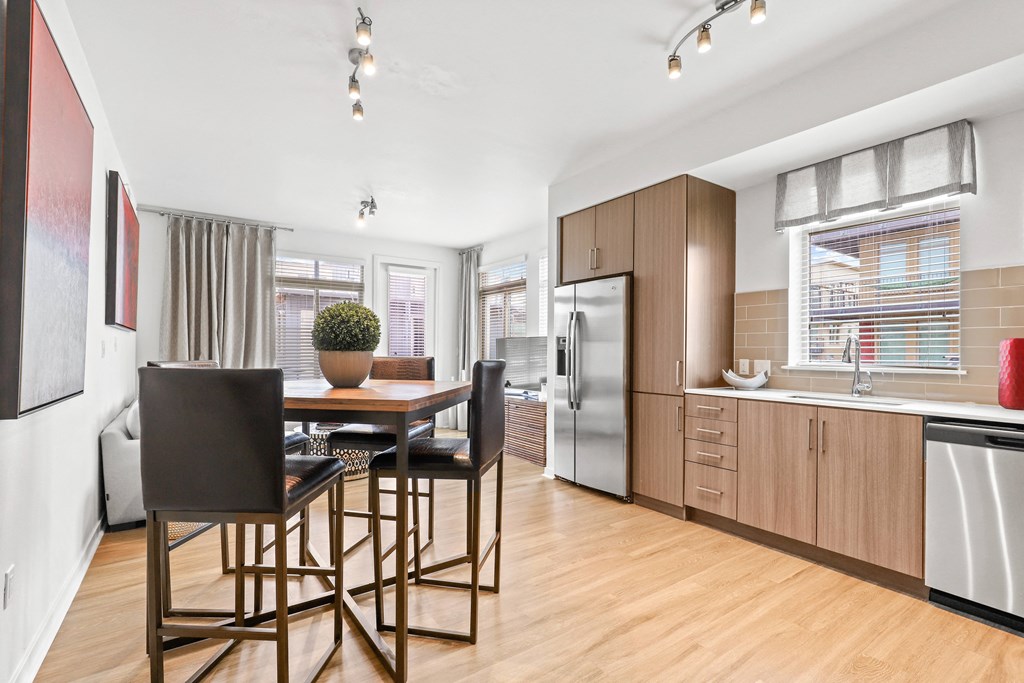 a kitchen and dining area in a 555 waverly unit