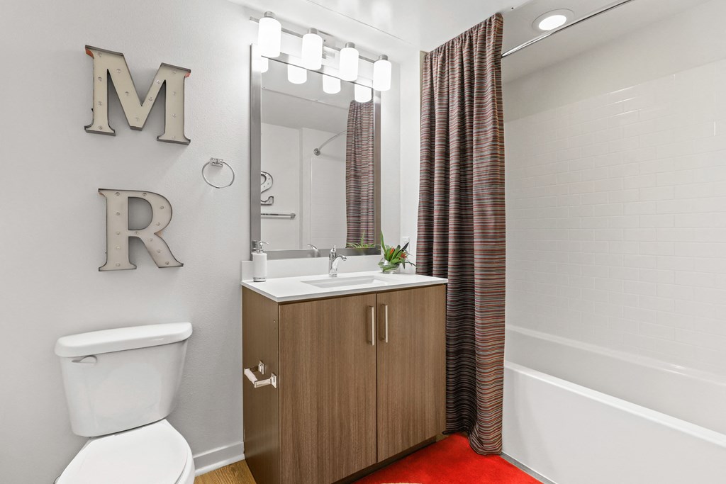 a bathroom with a toilet sink and bathtub