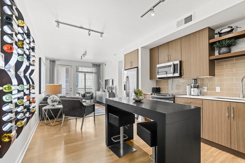 a kitchen and living room in a 555 waverly unit