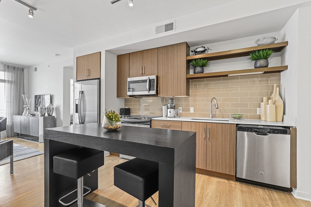 a kitchen and dining area in a 555 waverly unit