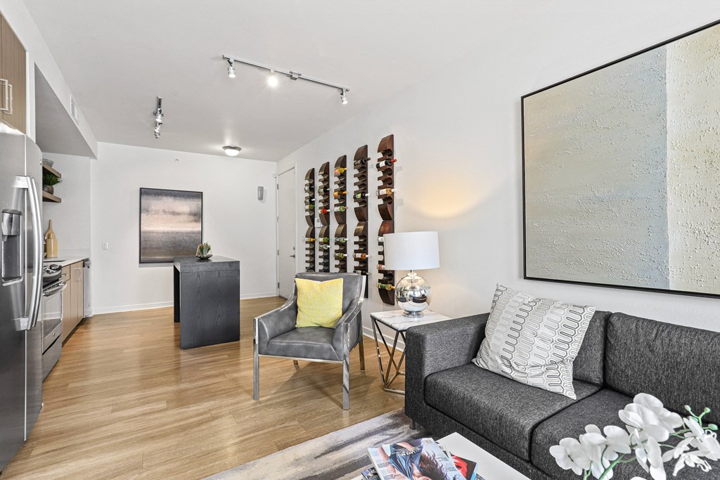 a living room with a couch and two chairs