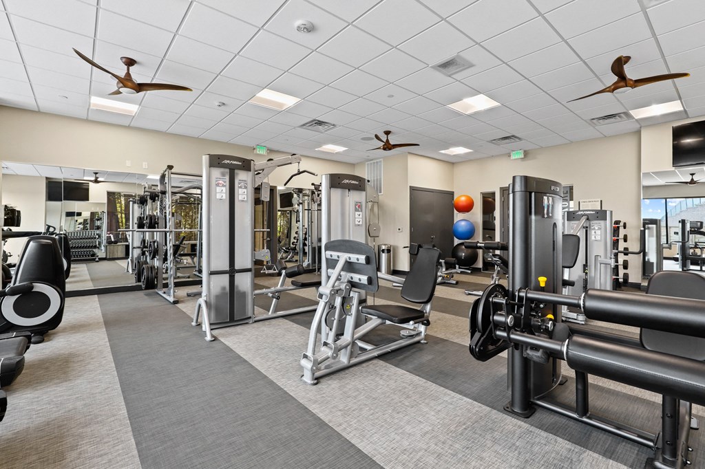 a large fitness room with cardio equipment and weights at Union West Apartments, Lakewood, Colorado