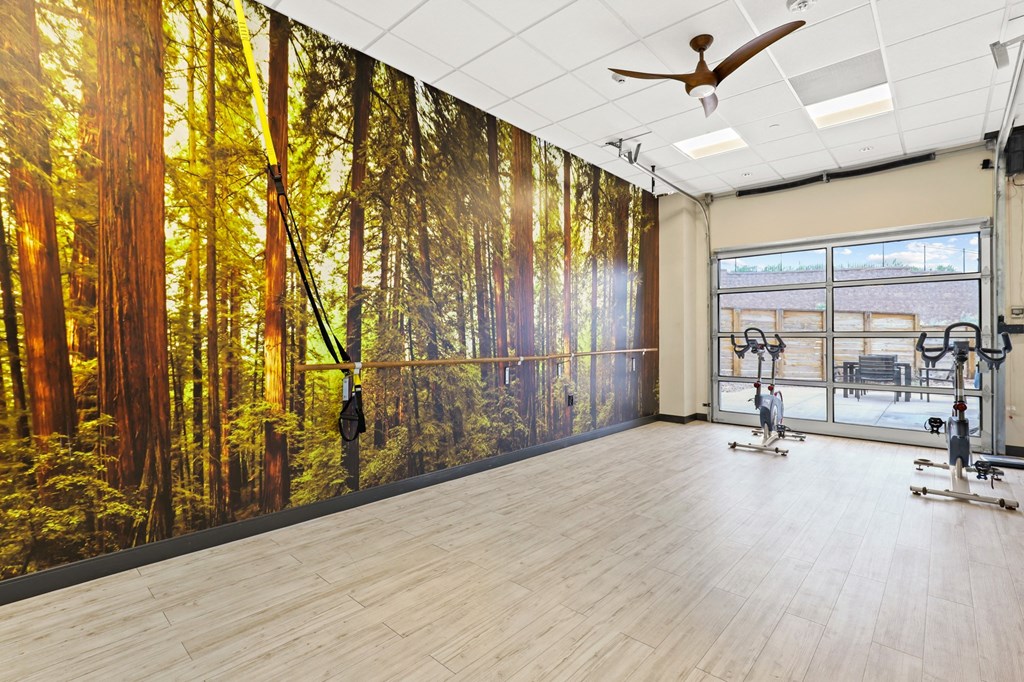 a yoga studio with a large mural of a forest at Union West Apartments, Lakewood, 80228