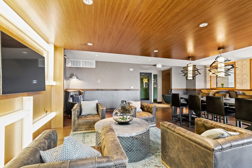 a living room filled with furniture and a flat screen tv at Union West Apartments, Colorado 80228