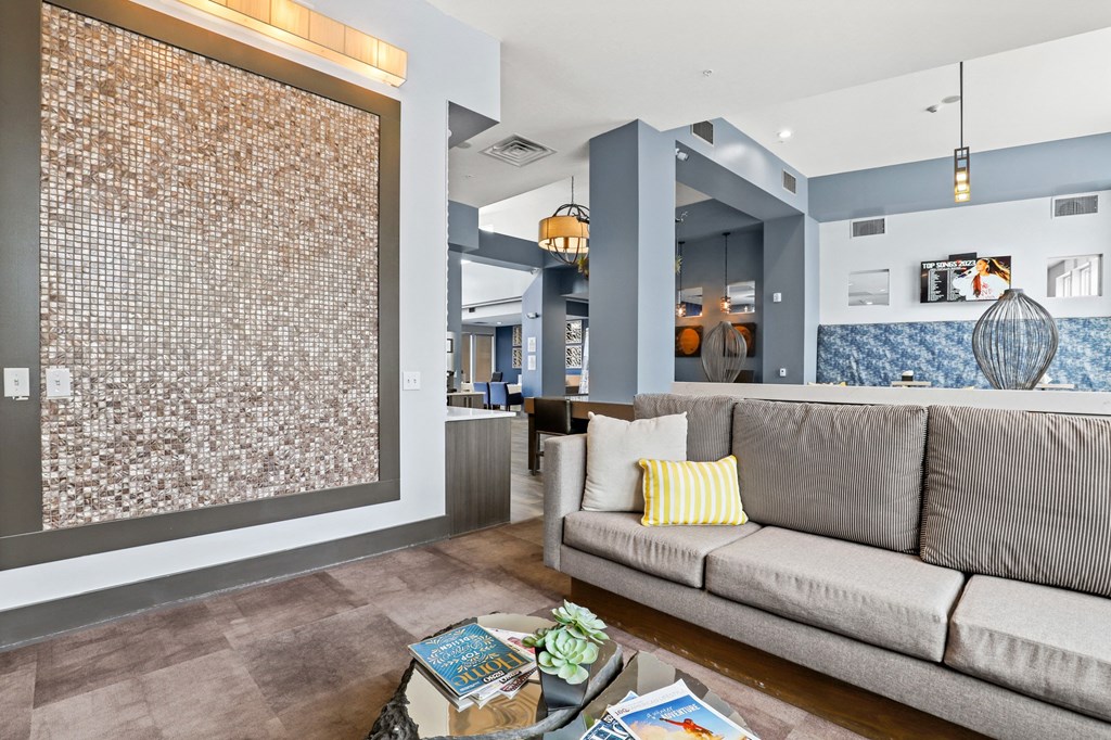 seating area with yellow cushions in clubhouse at Westlink at Oak Station Apartments in Lakewood, CO