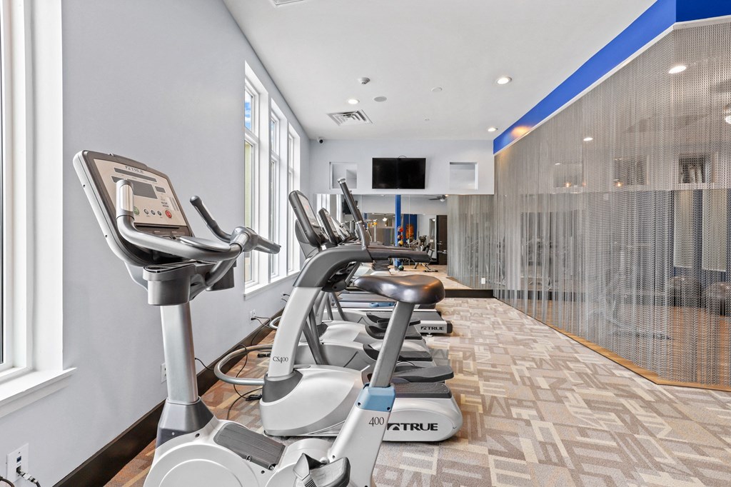the gym at the enclave at woodbridge apartments in sugar land, tx