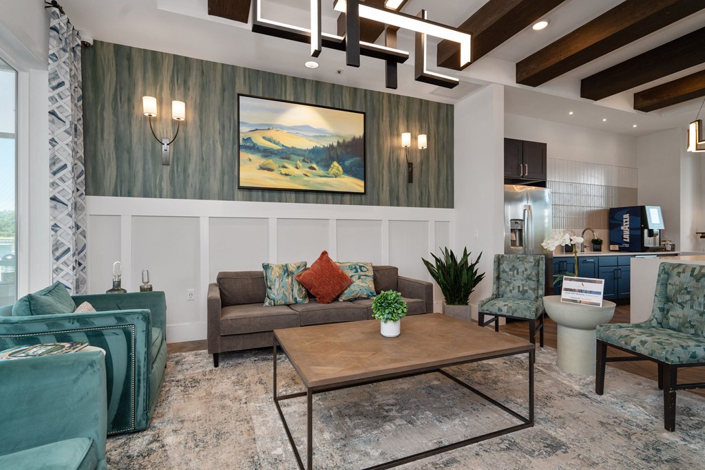 a living room with couches and chairs and a coffee table at Artesia at Lakewood Ranch Apartments, Florida 34211