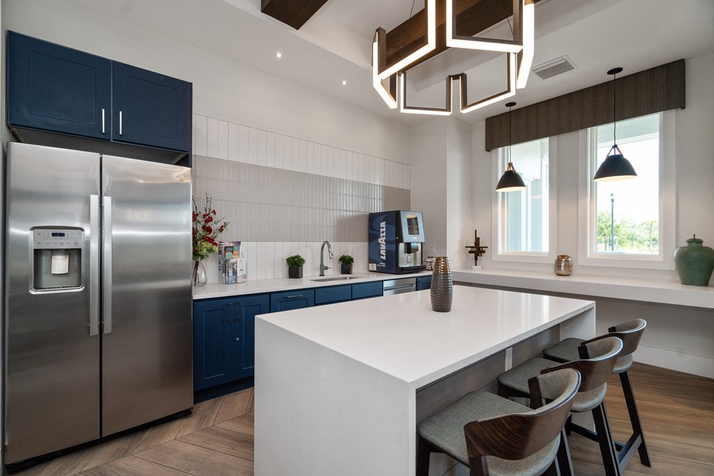 a kitchen with stainless steel appliances and a white counter top at Artesia at Lakewood Ranch Apartments, Florida