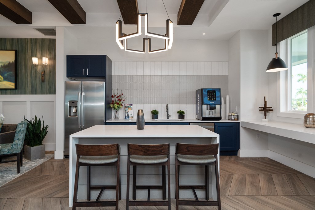 view of clubhouse with white table and kitchen at Artesia at Lakewood Ranch Apartments, Florida