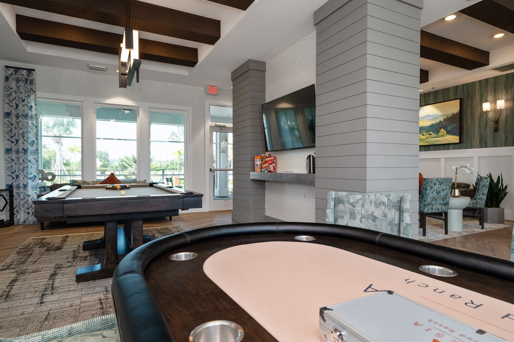 a game room with a pool table and a television at Artesia at Lakewood Ranch Apartments, Bradenton, FL