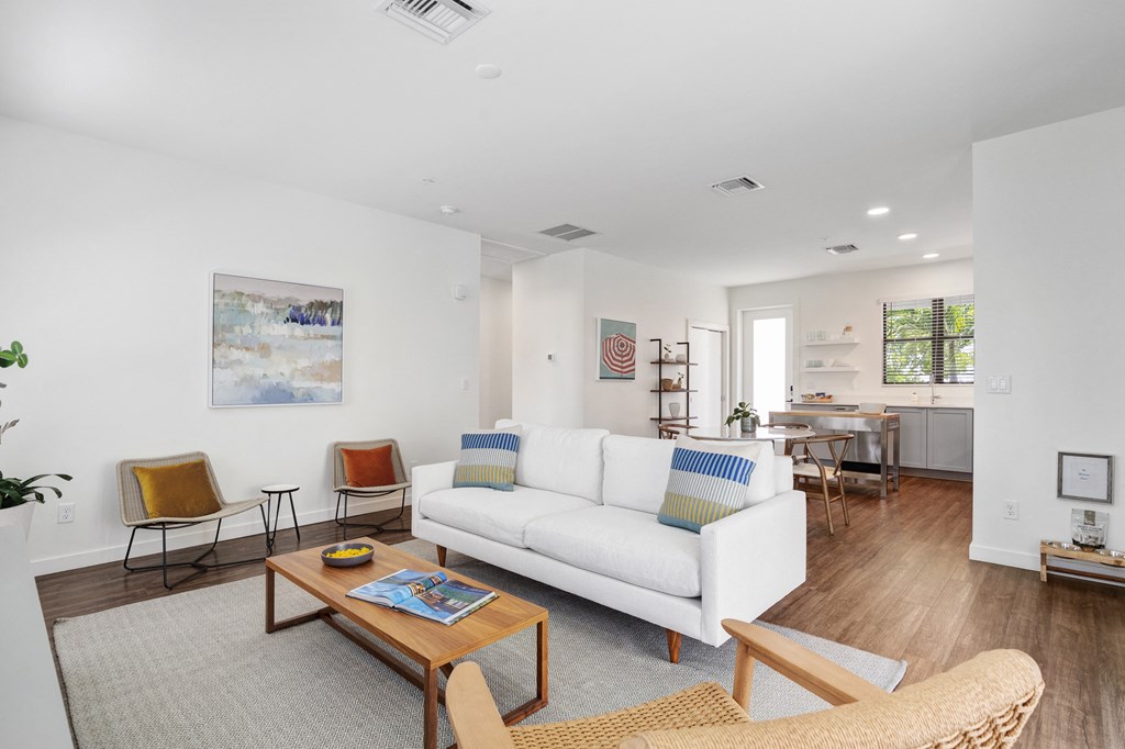a living room with a white couch and a coffee table at Odyssey, Florida