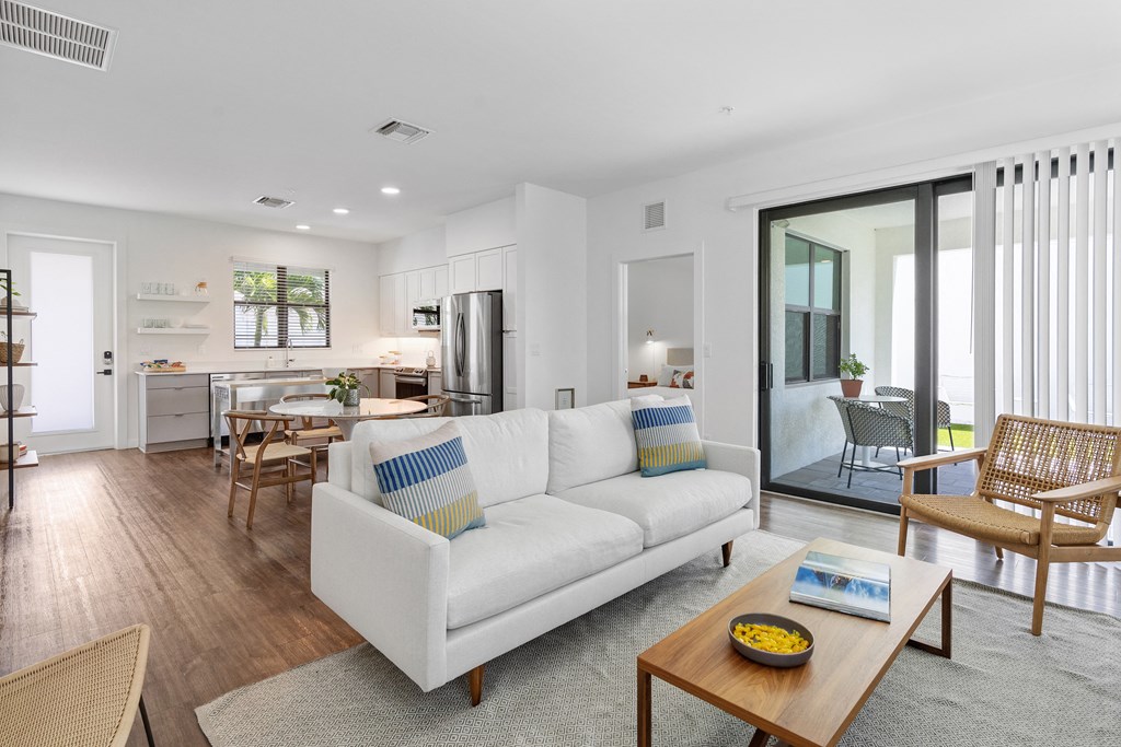 a living room with a white couch and a coffee table at Odyssey, Fort Myers, FL, 33905