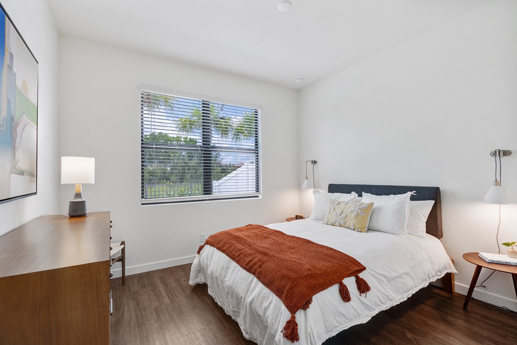 a bedroom with a bed and a window at Odyssey, Florida, 33905