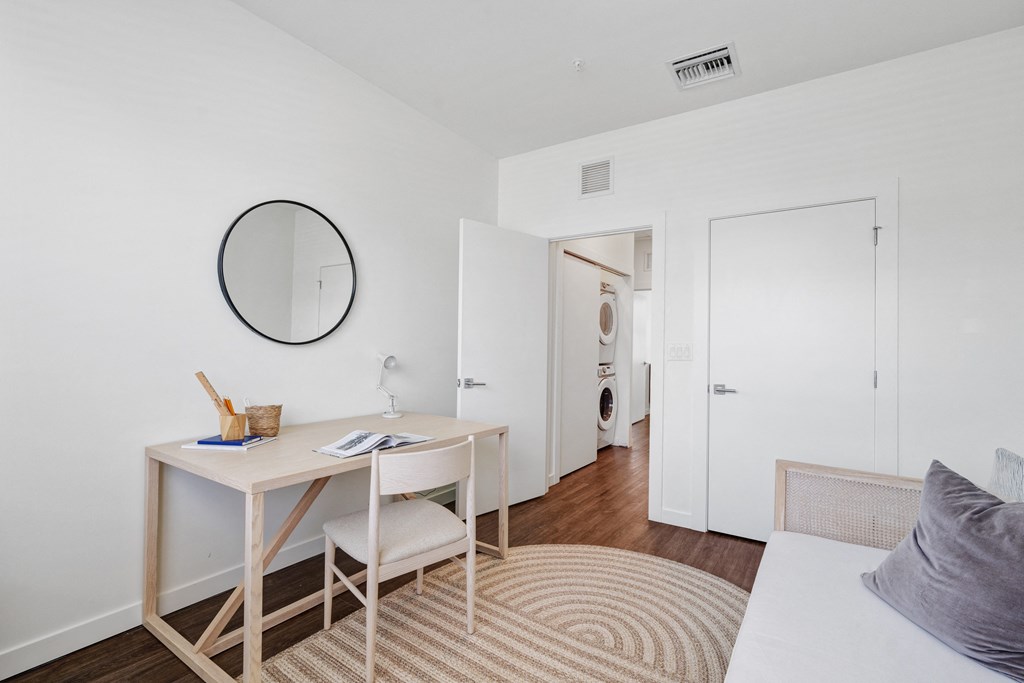 a small room with a desk and a mirror at Odyssey, Fort Myers, FL, 33905