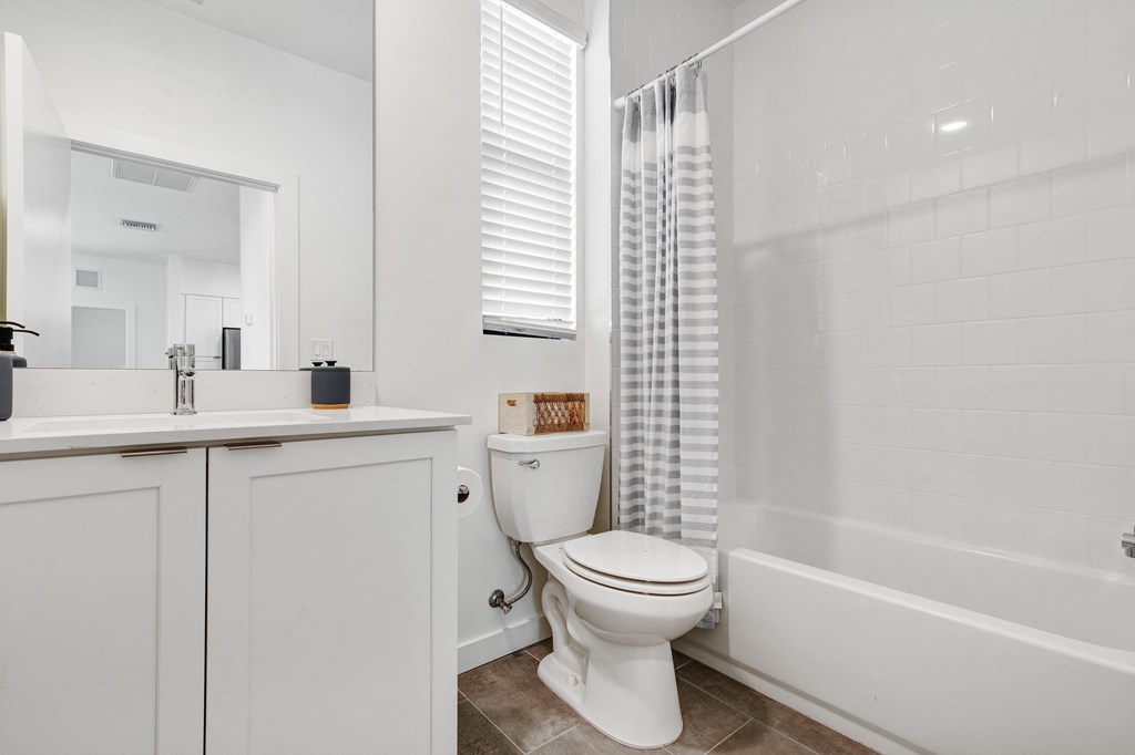 a bathroom with a shower and a toilet and a sink at Odyssey, Fort Myers, Florida