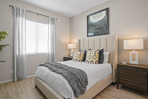 an overview of a bedroom with a bed and a window at Soleil at Canyon Trails Apartments, Arizona