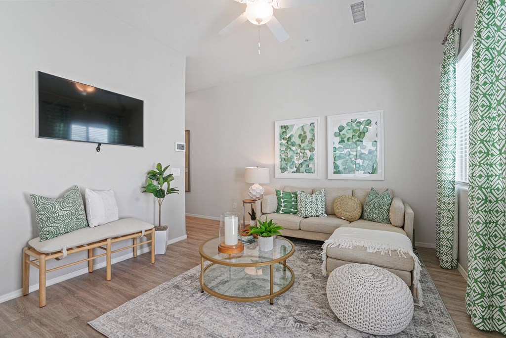 a living room with two couches and a tv at Sienna at South Mountain Apartments, Arizona, 85339