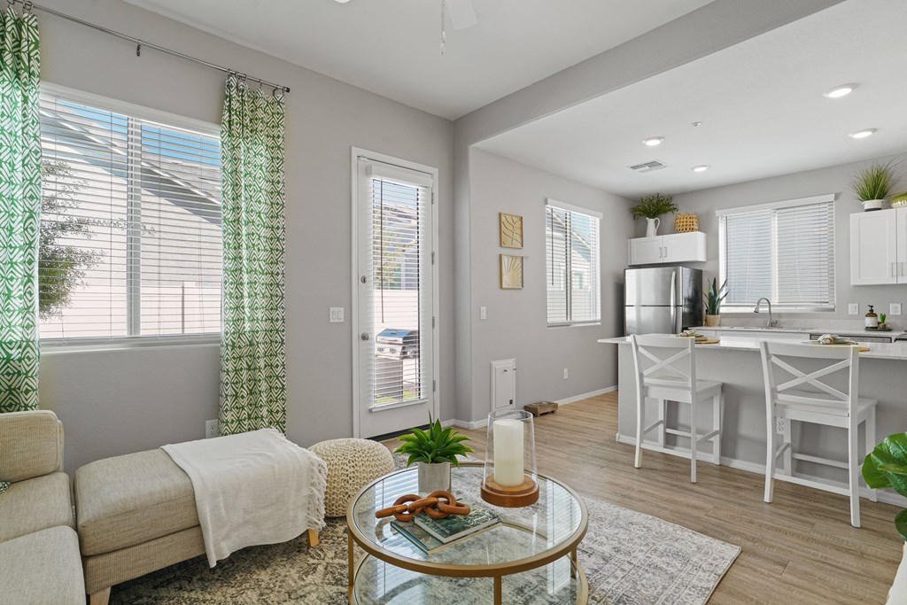 a living room with a couch and a table at Sienna at South Mountain Apartments, Arizona