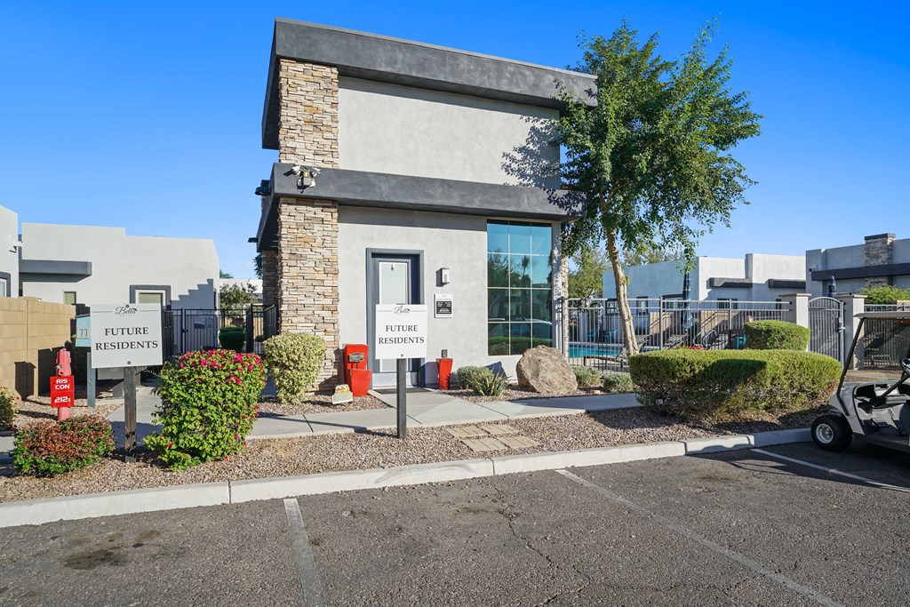 the front of a building with a parking lot and a sign that reads center services