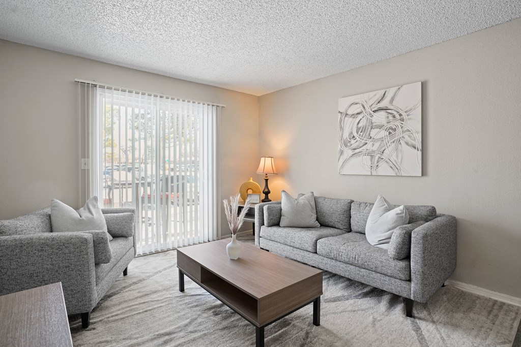 a living room with couches and a coffee table