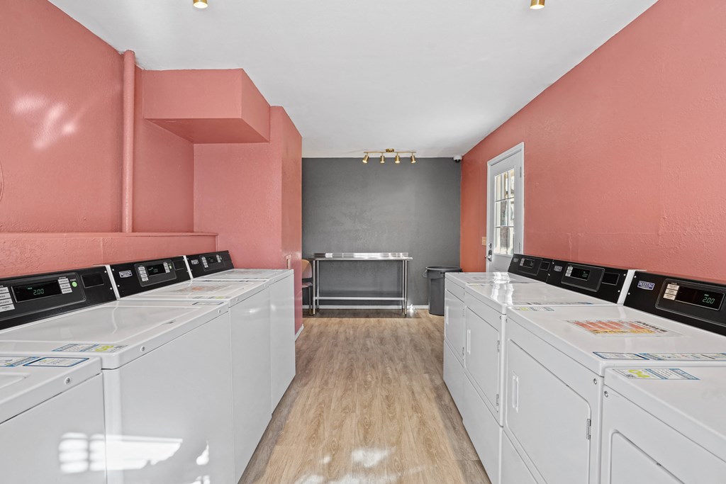 washer and dryers in pink room
