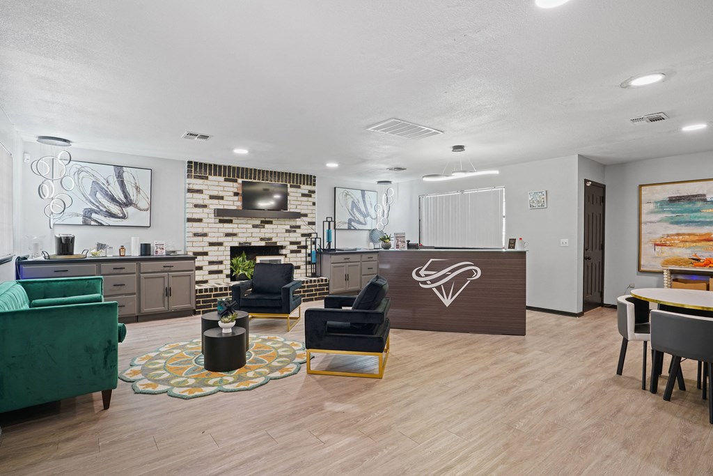 large clubhouse with green couch and chairs